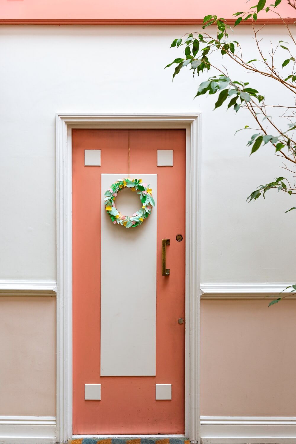 A pink pastel art deco front door in listed building