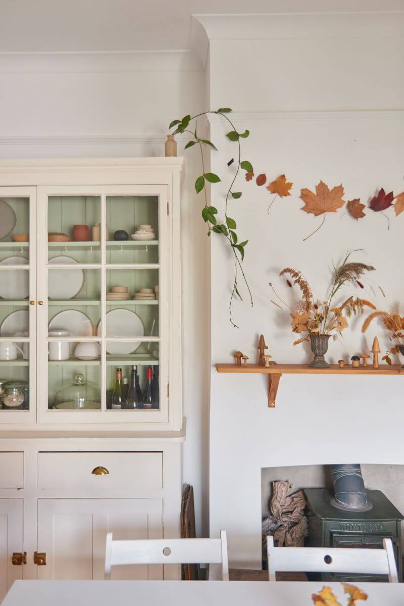 Rustic cabinet in the kitchen decorated with plants and lamp