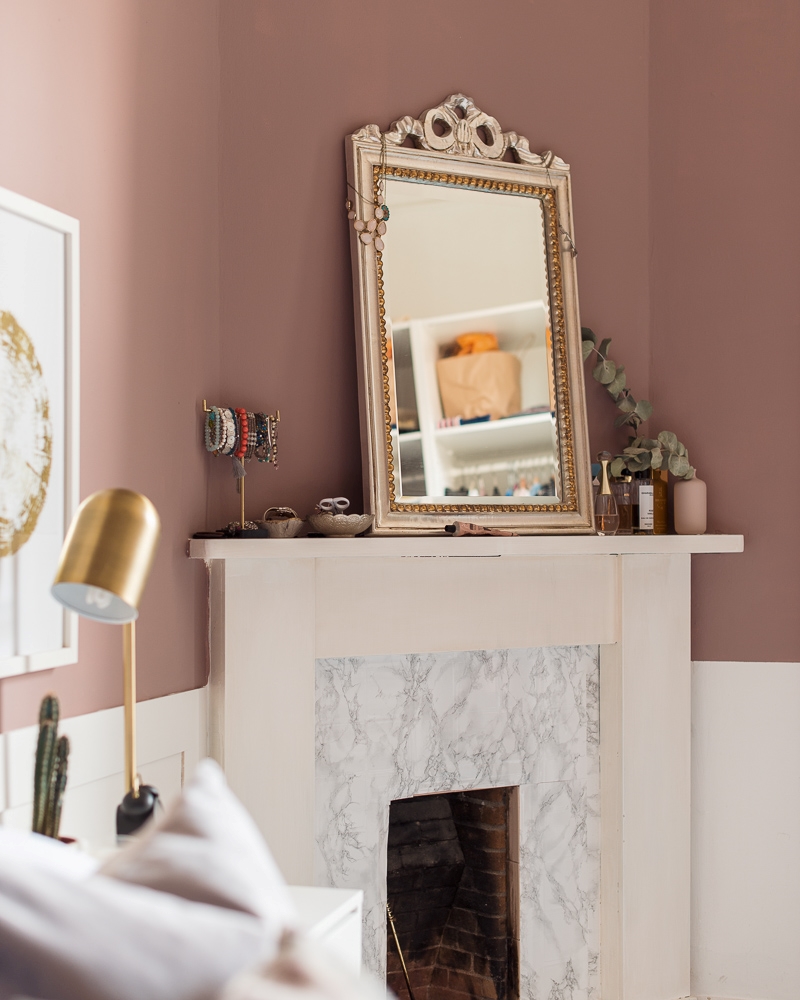 Styled marble fireplace mantle in the bedroom