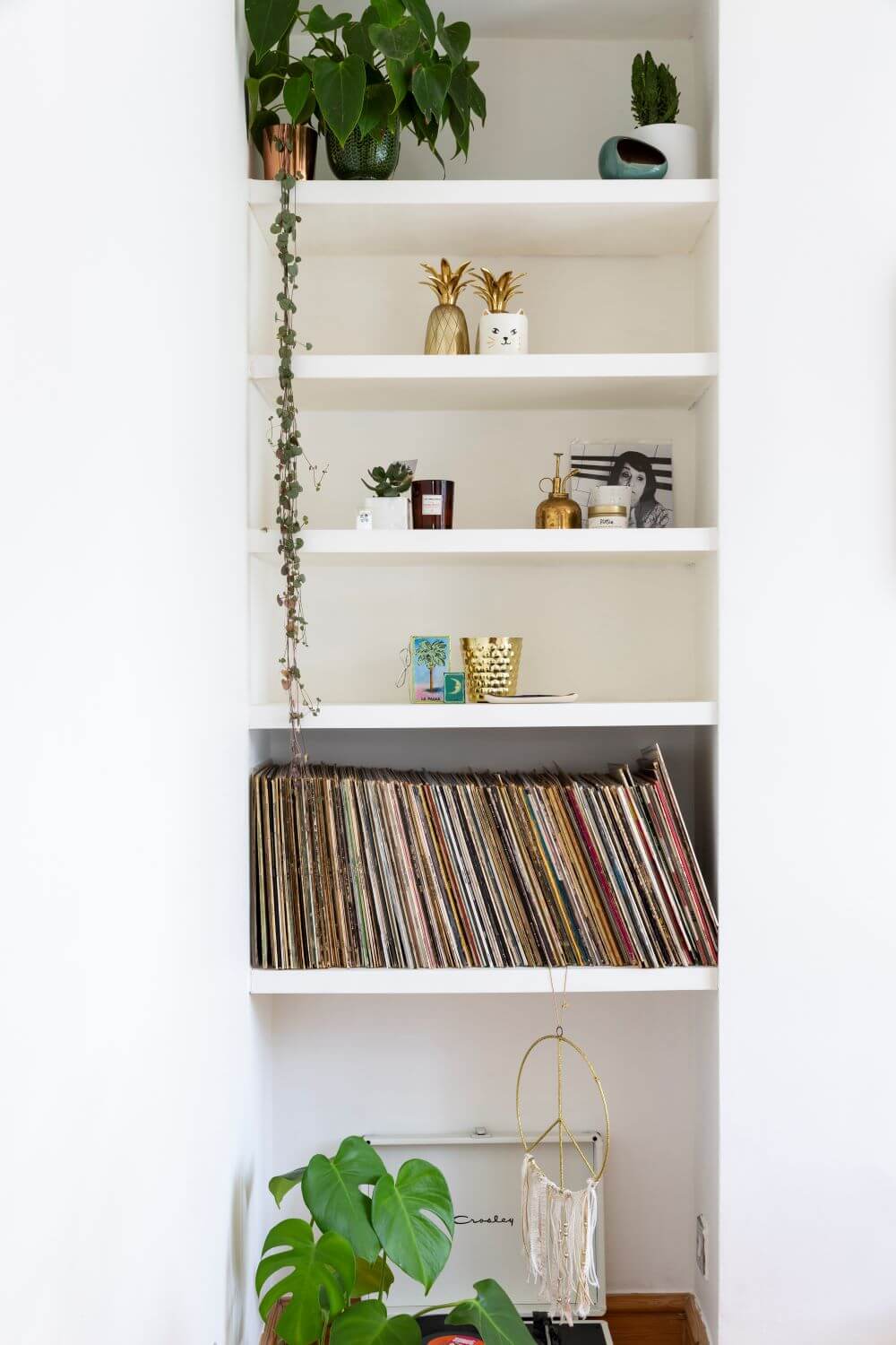 Decorate with Pink Home tour: Styles white shelves alcove with plants and records 