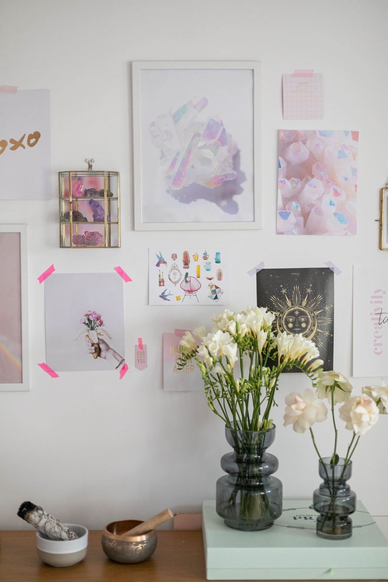 A gallery wall using washi tape and below is 2 vases of fresh flowers
