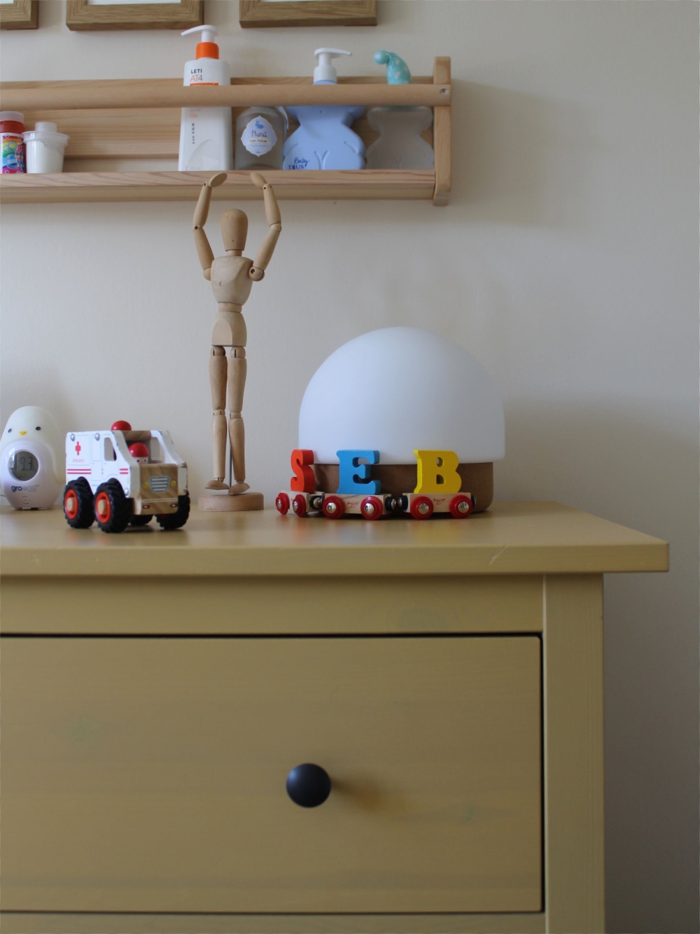 Wooden toys displayed on IKEA drawers 